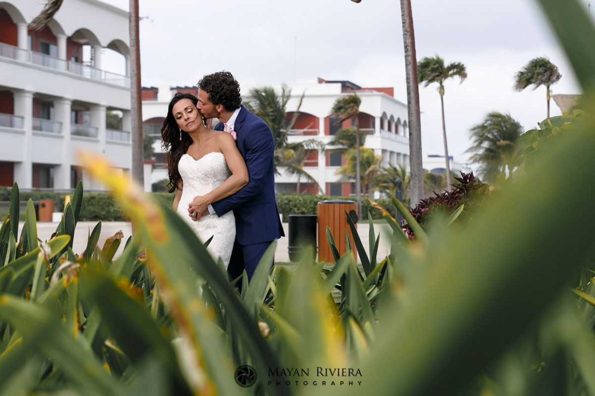 NewlywedsHoldEachOtherOnGardenPath