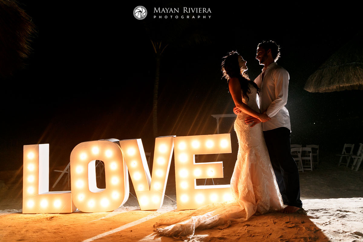 NewlywedsPoseByLOVESign