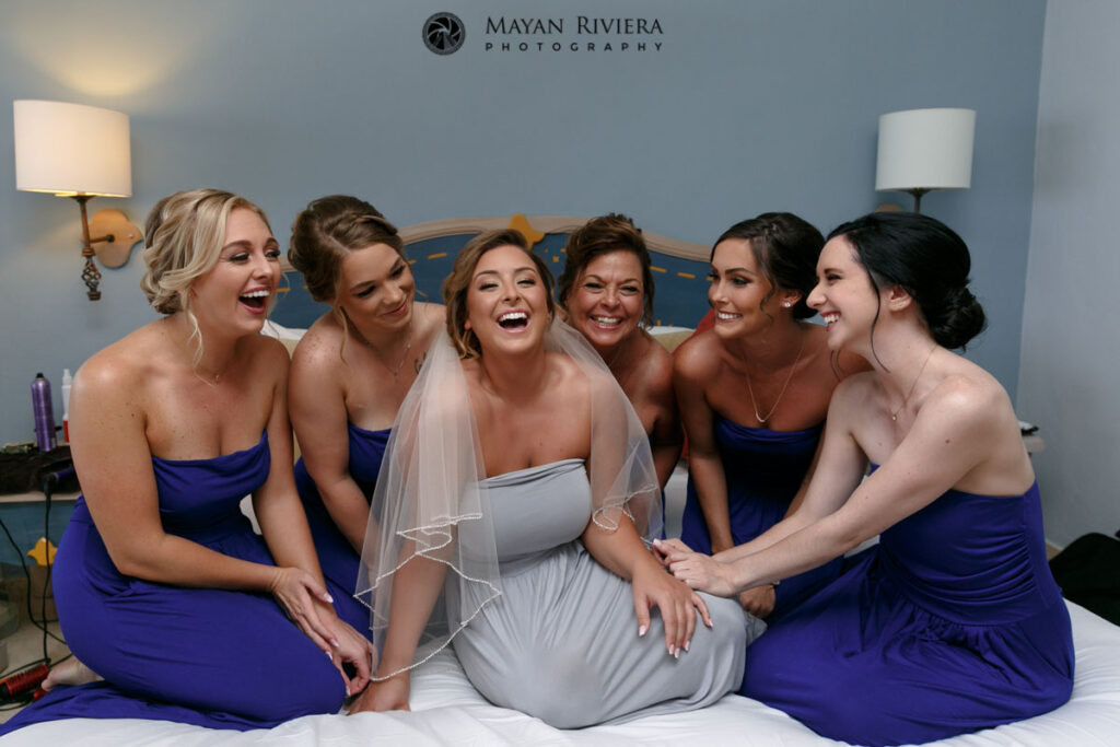 LaughingWeddingPartyOnBed