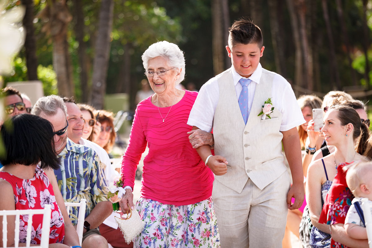 GrandsonWalksGrandmaIntoberostarTucanBeachsideWedding