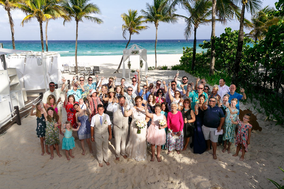 CheeringGuestsToastNewlywedsInDroneShot