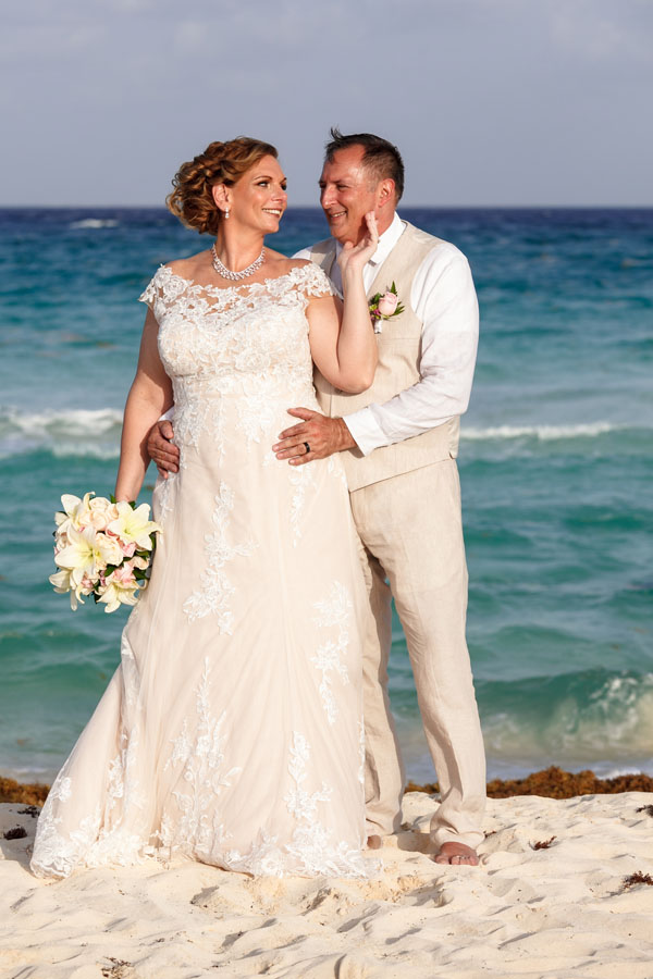 NewlywedsPoseOnBeach