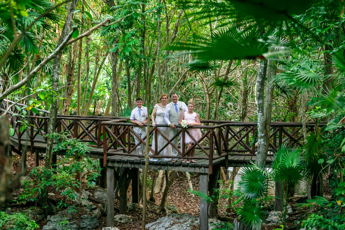 NewlywedsWithKidsPoseOnJungleBridge