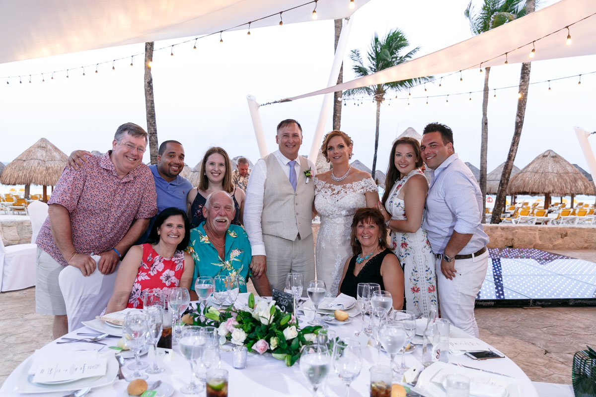 NewlywedsPoseWithGuests