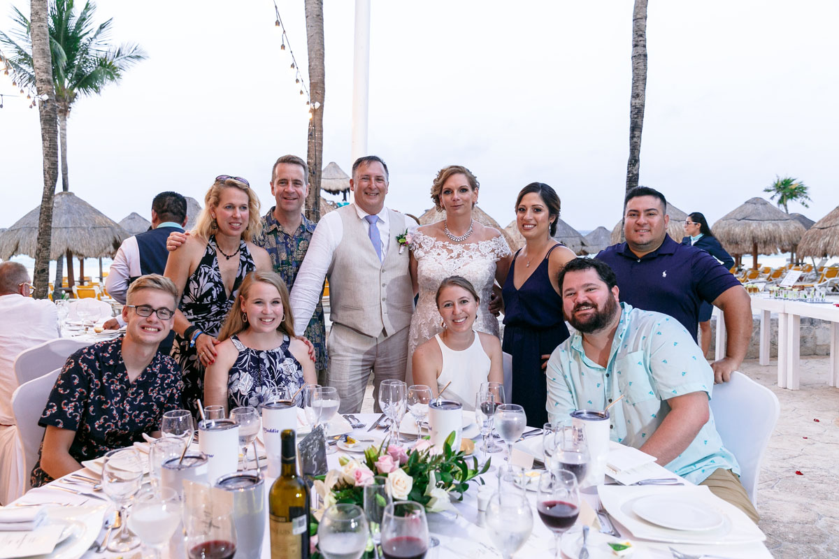 NewlywedsPoseWithGuests