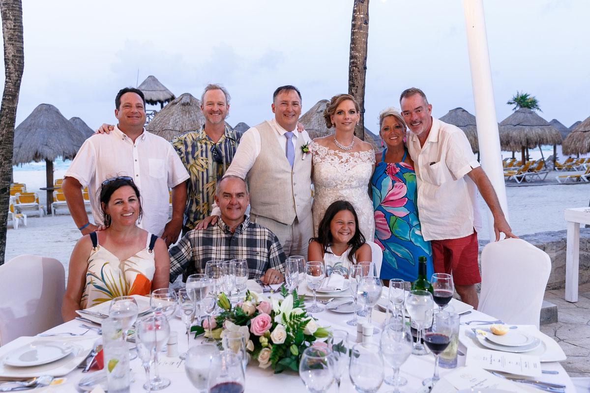 NewlywedsPoseWithGuests