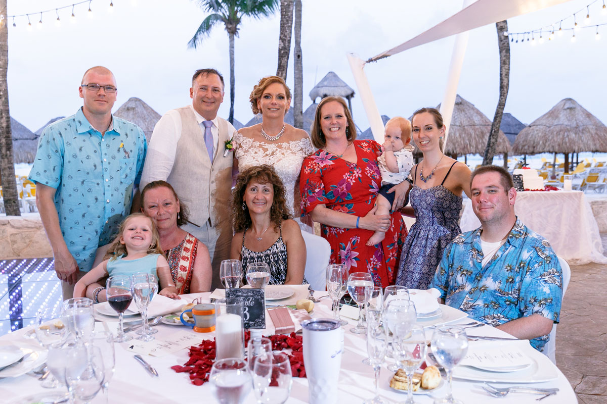 NewlywedsPoseWithGuests