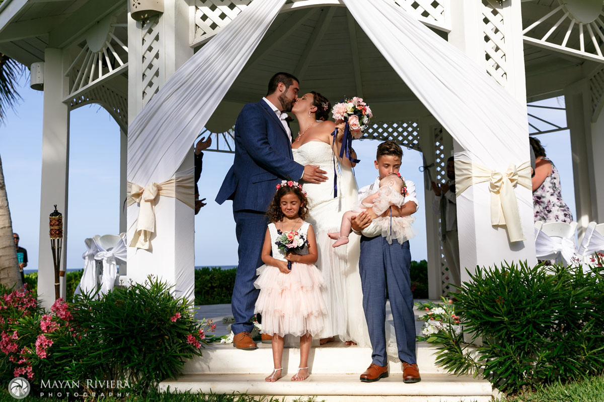 NewlywedsKissBehindEmotionalKids