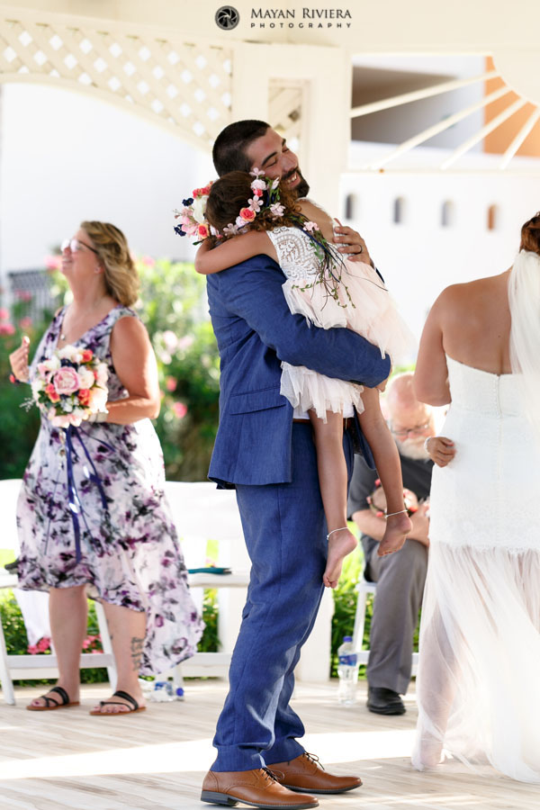 GroomHoldsEmotionalDaughter