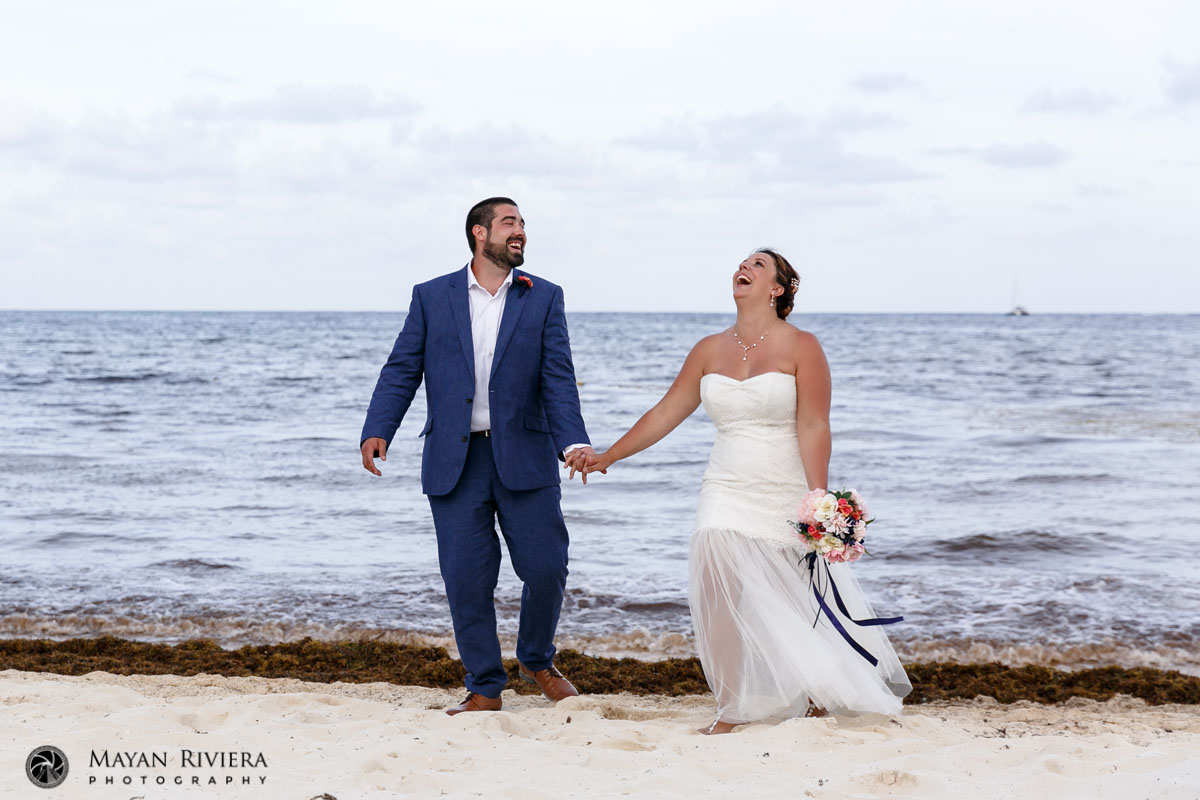 LaughingNewlywedsOnBeachWalk