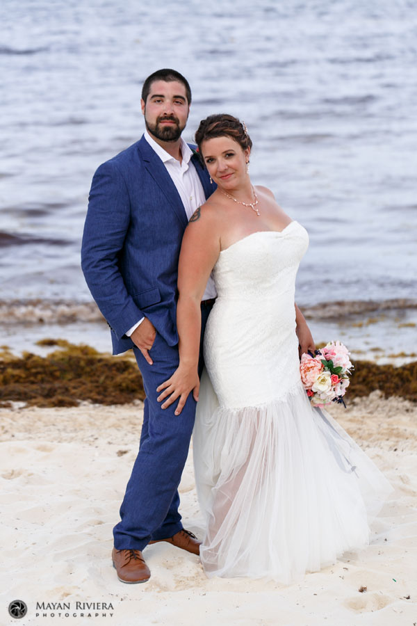 NewlywedsPoseTogetherOnBeach