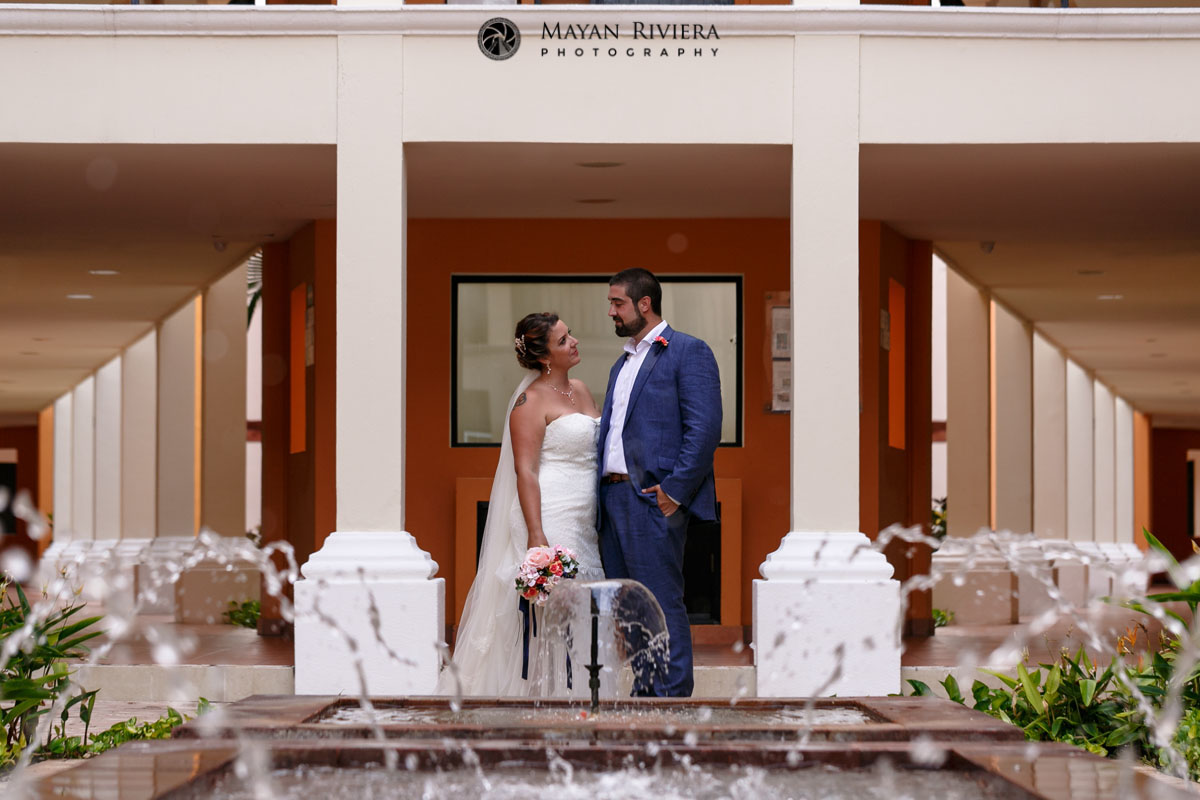 NewlywedsPoseByWaterFountains