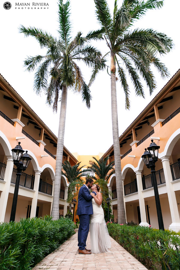 NewlywedsKissOnGardenPath