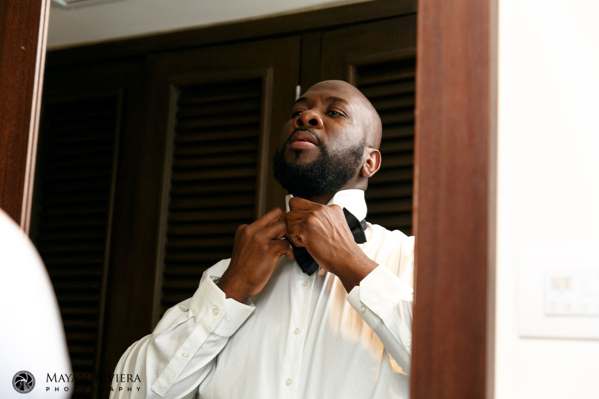 GroomGettingReadyTyingBowTie