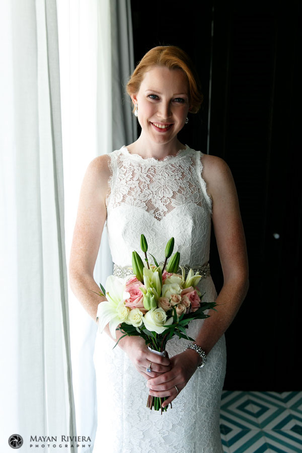 SmilingBrideStandingWithBouquet
