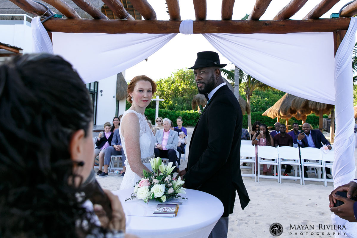 WeddingCoupleGazesAtOfficiant