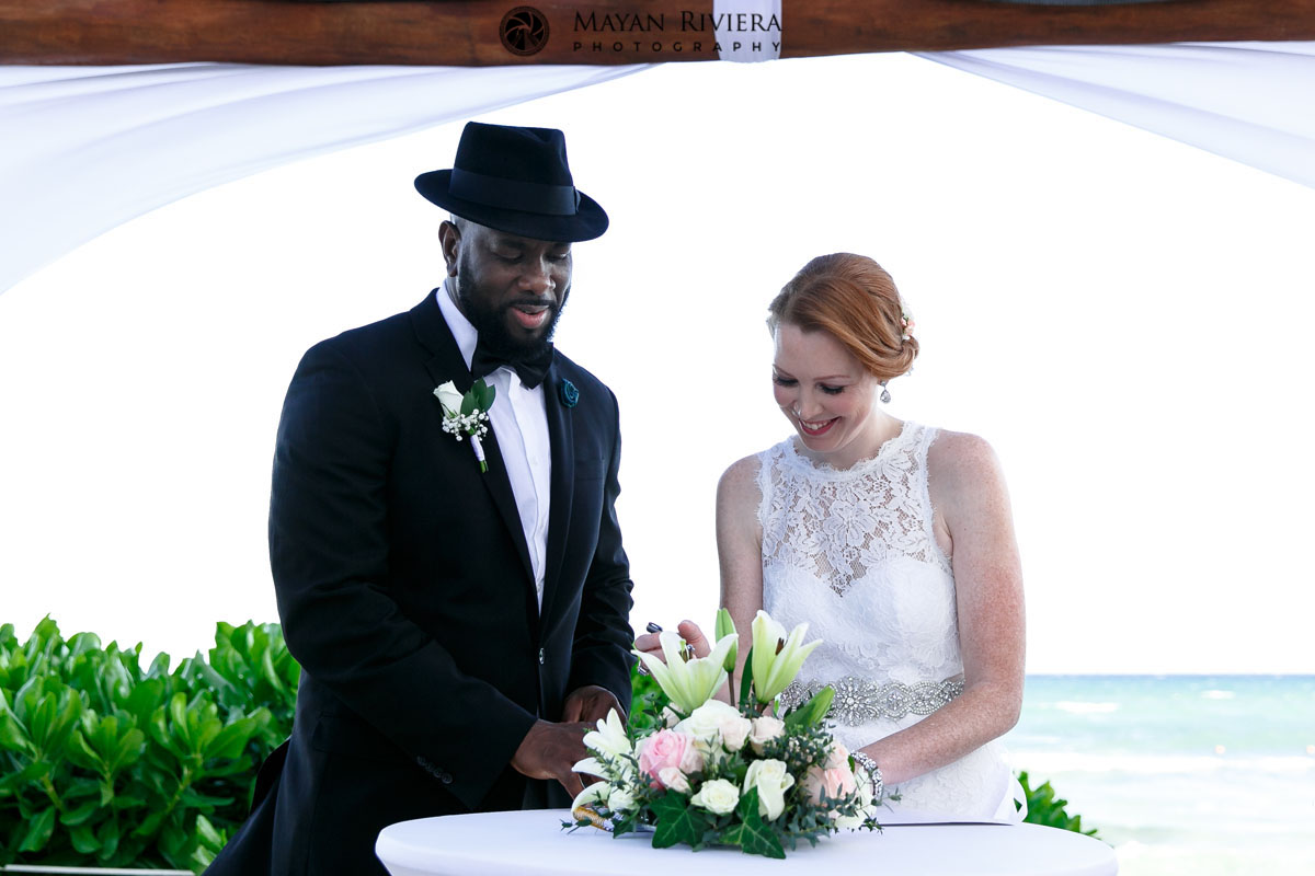 WeddingCoupleSignsMarriageCertificate