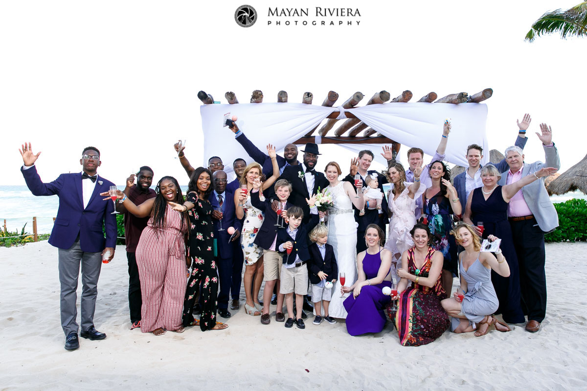 CheeringWeddingGuestsToastNewlywedsInDroneShot