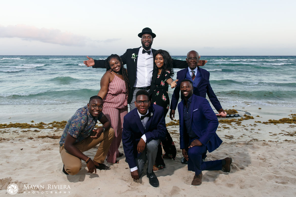 GroomCheeringWithFriendsOnBeach