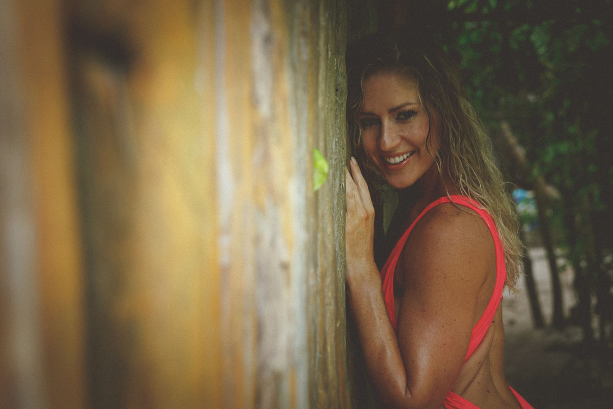 GirlLeaningAgainstPostWall