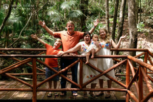 CheeringFamilyPosesOnBridge