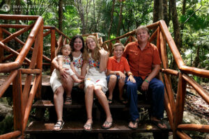 CheeringFamilyPosesOnBridgeSteps