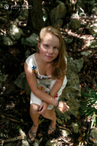 SaraSitsOnRockLookingUp