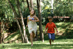 SaraRunsWithLittleBroOnLawn