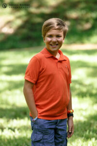 LittleBroPosesOnLawn