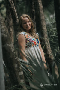 SmilingSaraLeansOnJungleTree