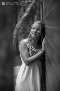 SmilingSaraLeansOnWall