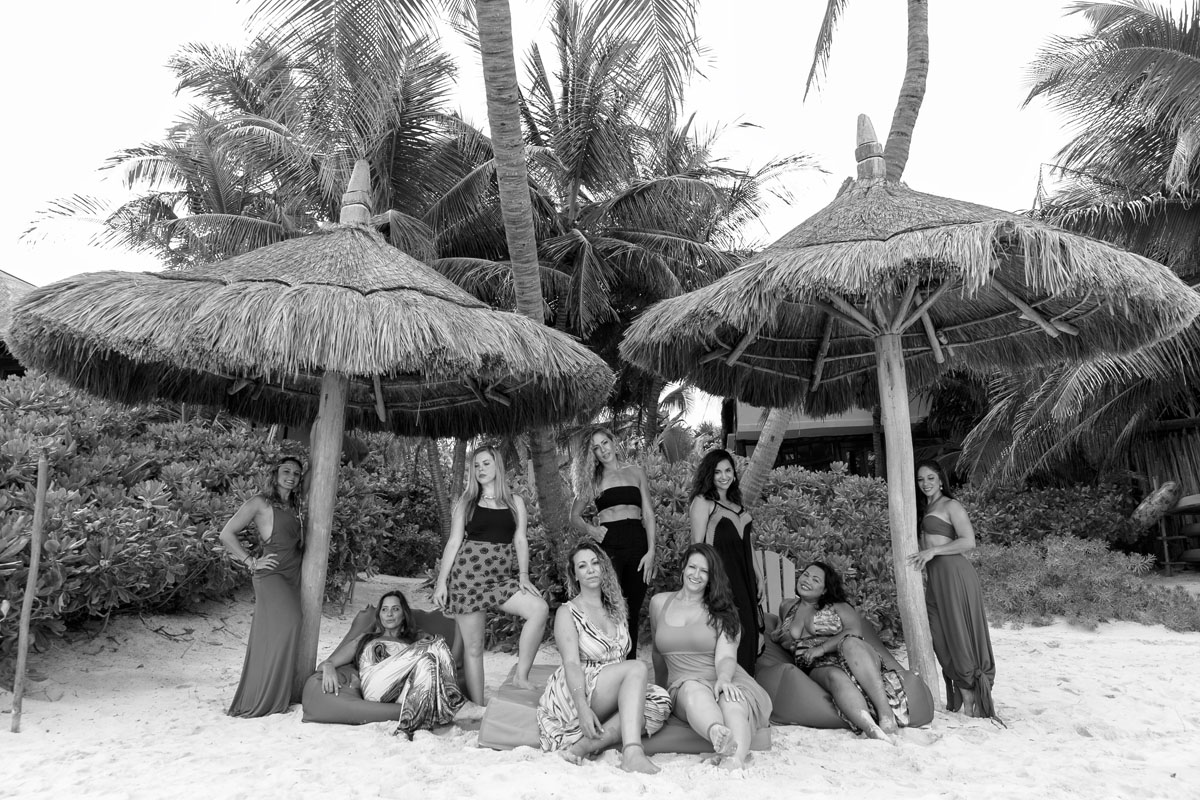 FriendsRelaxOnSunBedsUnderPalapas