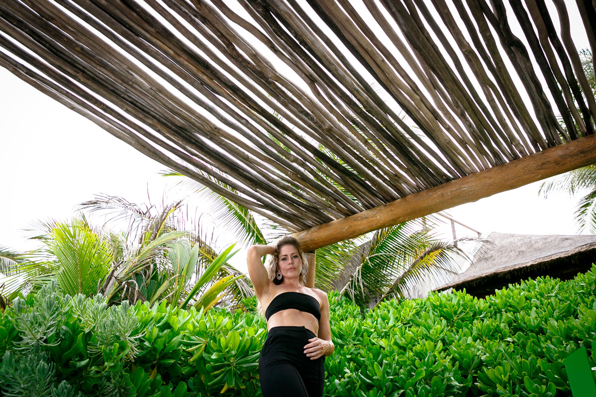 GirlPosesUnderBranchPergola