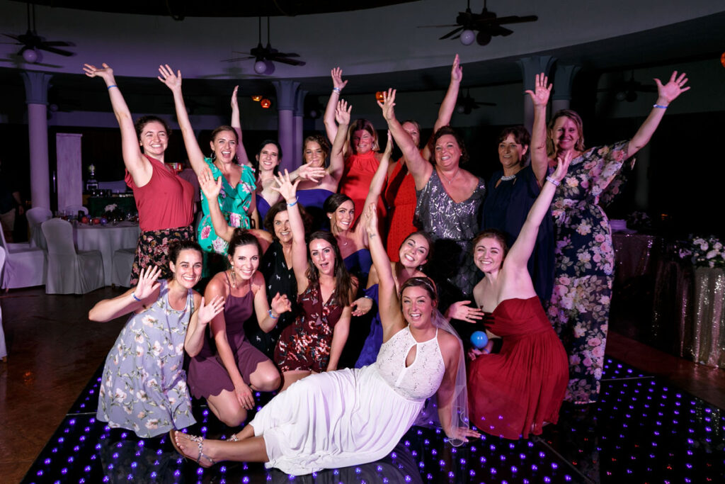 BrideSitsWithLadiesCheering