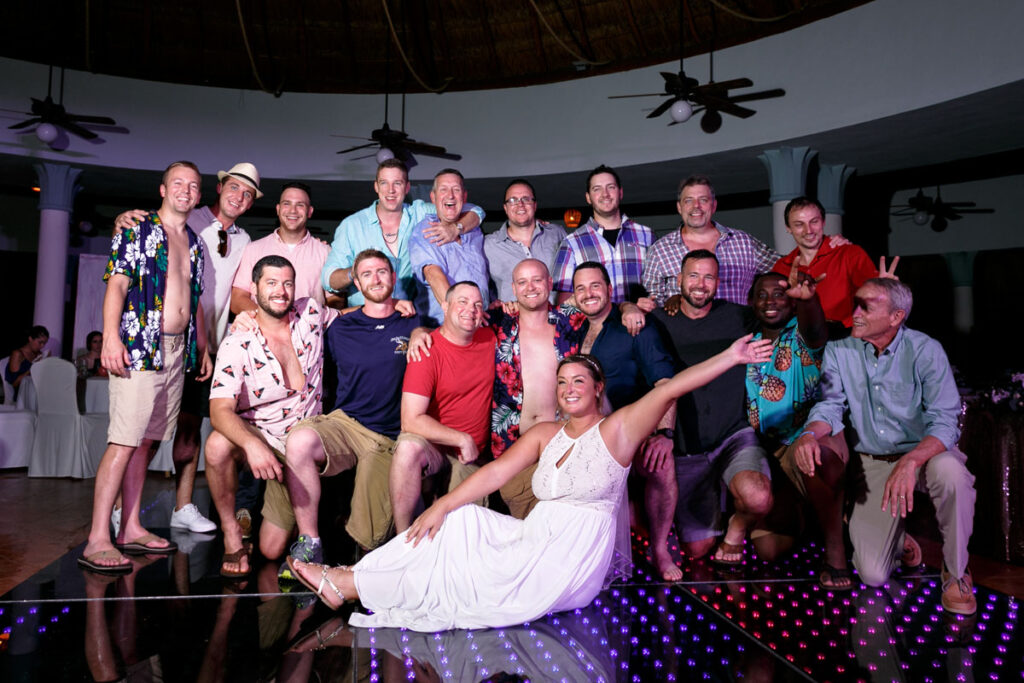 CheeringBrideWithKneelingGroomAndGuys