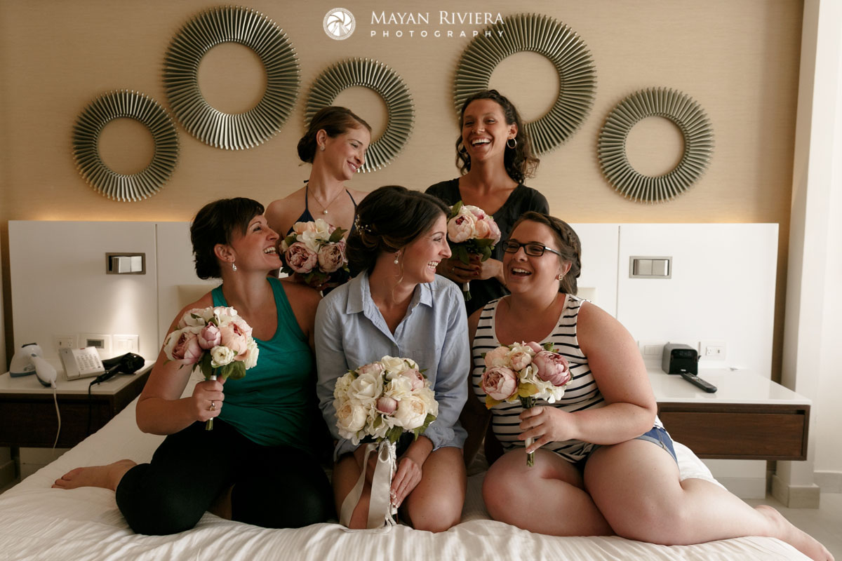 WeddingPartyLaughingOnBed