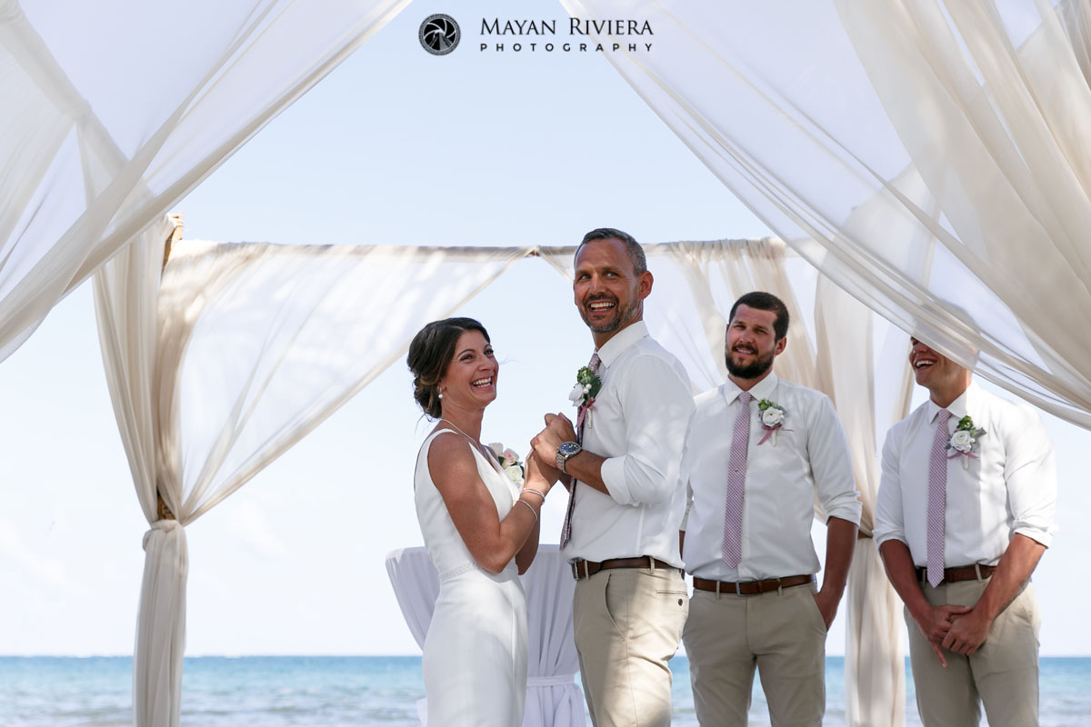 WeddingCoupleHoldHandsAtCeremony