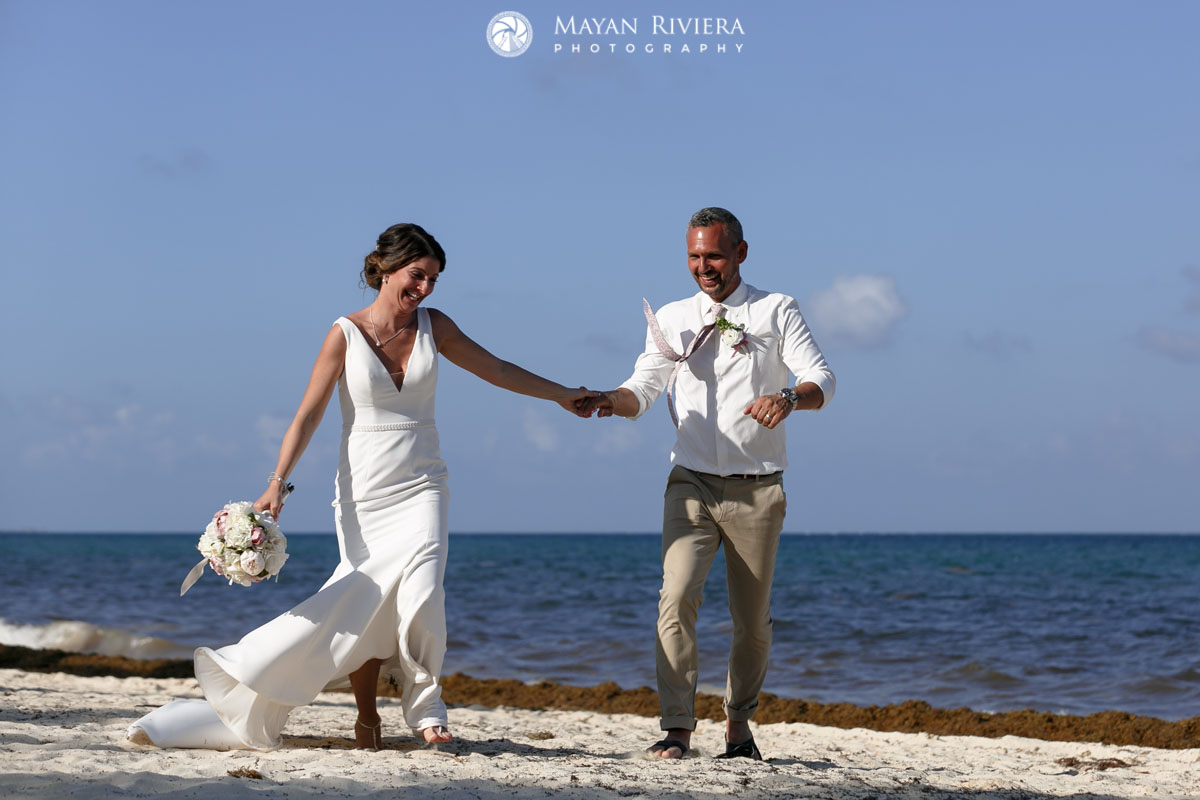 NewlywedsWalkOnBeach