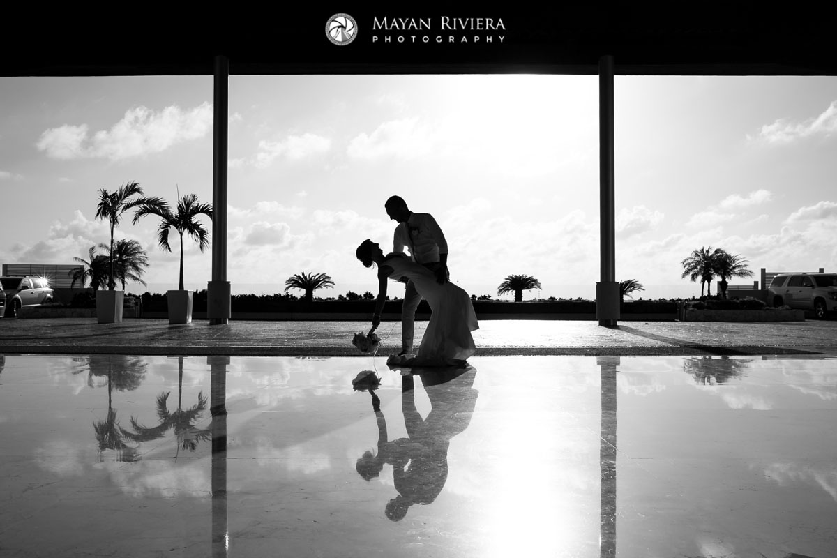 GroomDipsBrideInBigSkyReflection