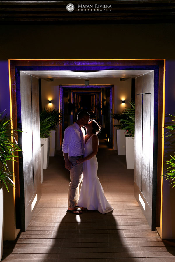 NewlywedsKissInHallway