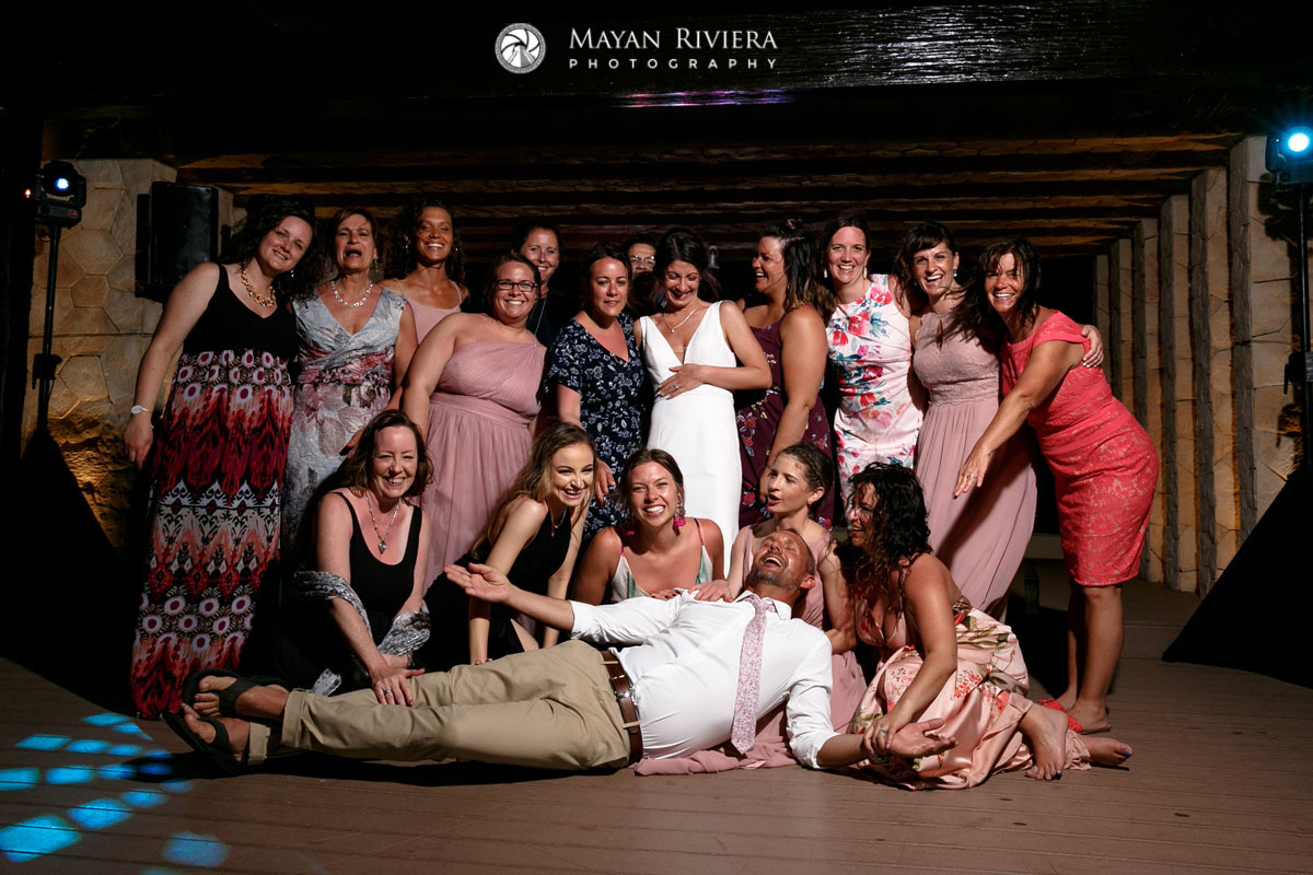 LaughingGroomReclinesInFrontOfGirls