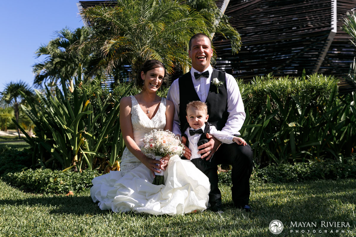 NewlywedsSitOnLawnWithSon