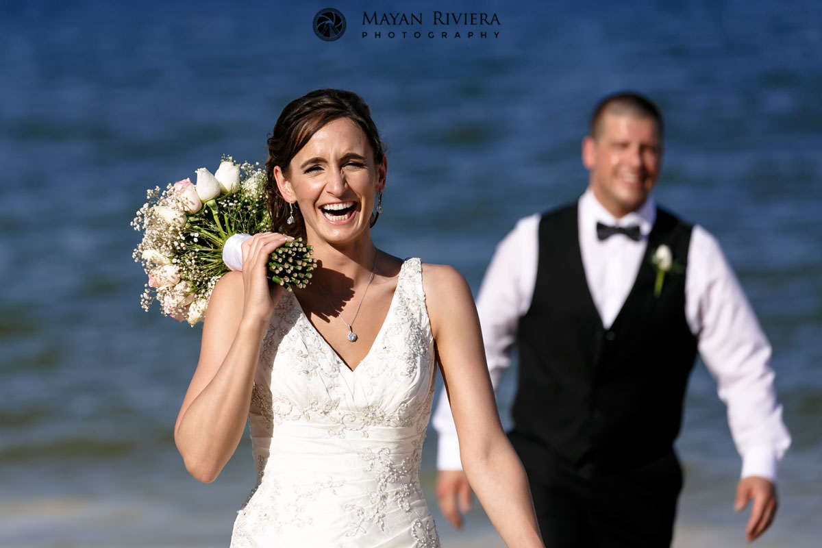 NewlywedsLaughOnBeach