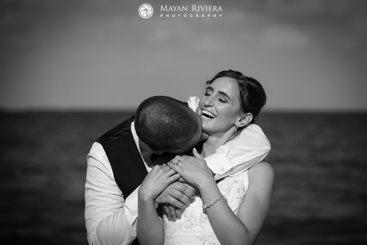 NewlywedsKissOnBeach