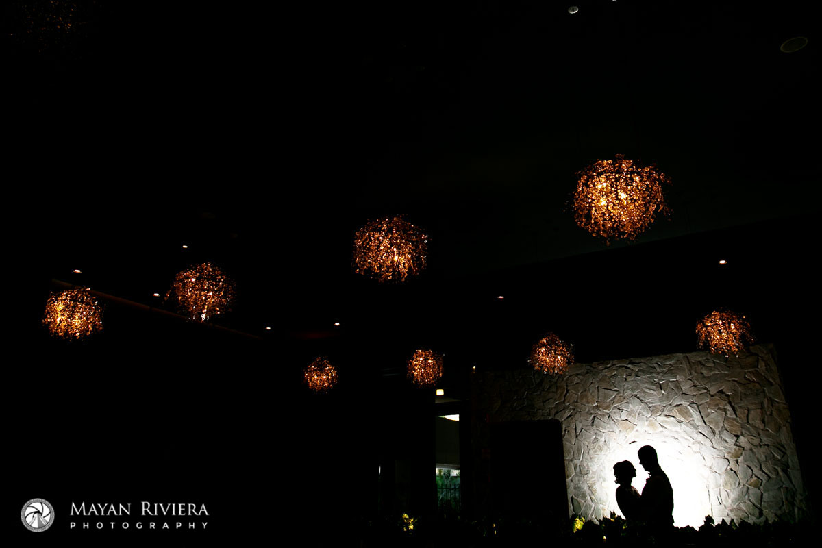 NewlywedsShilouetteOnStoneWall