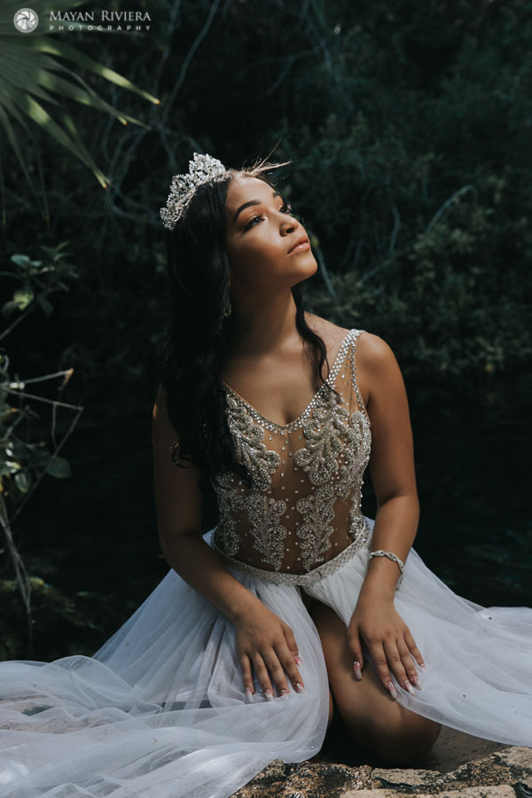 MelaniePosesOnCenoteRock