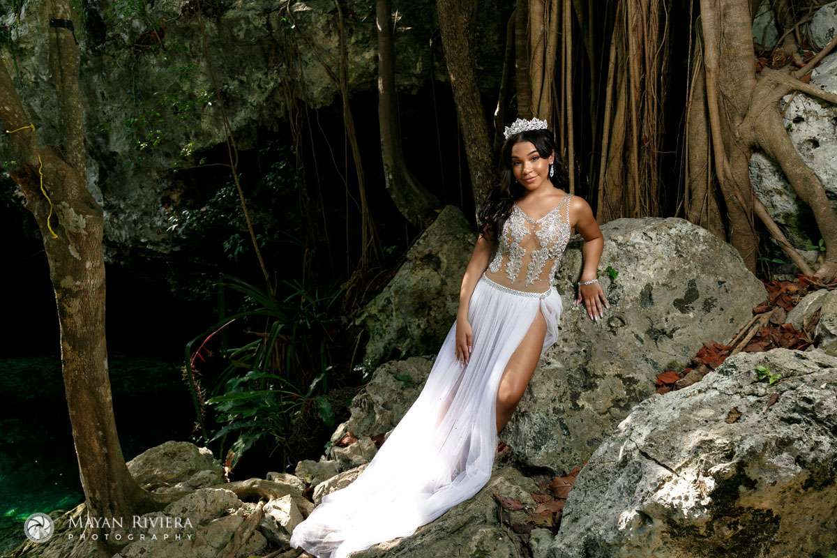 MelaniePosesOnCenoteRock