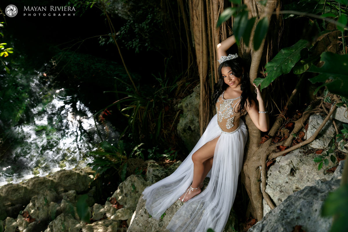 MelaniePosesOnCenoteRock