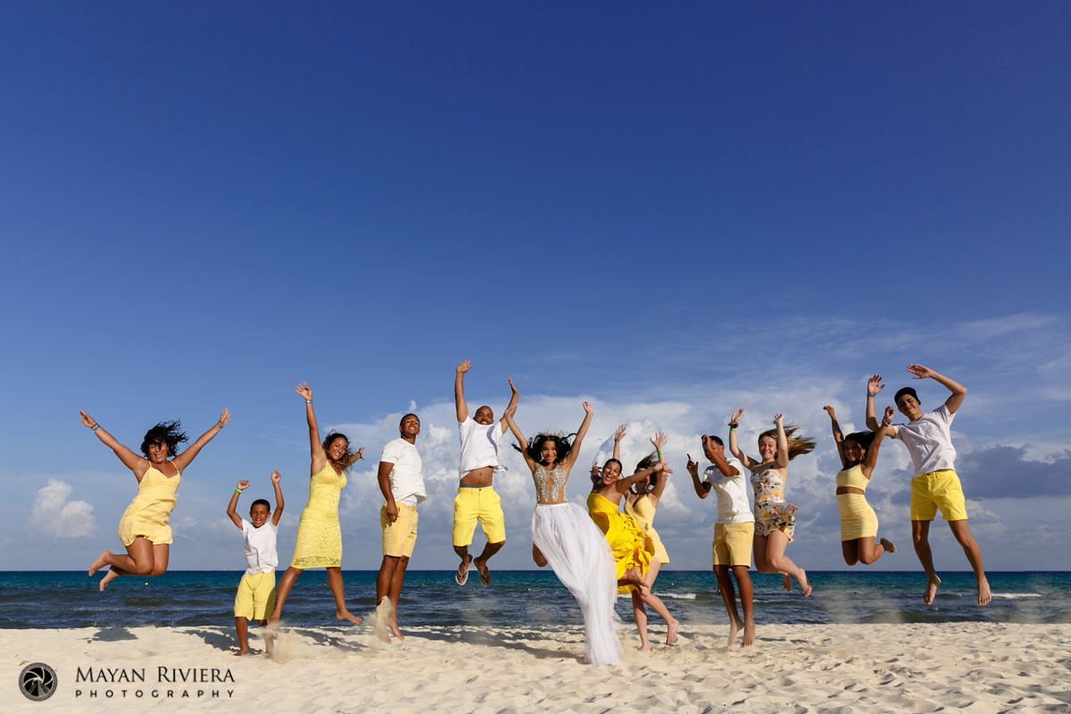 MelanieJumpsForJoyWithFamilyOnBeach