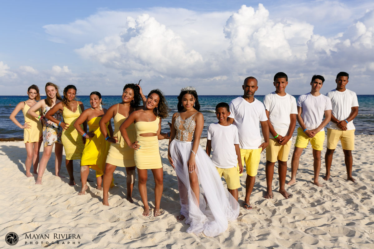 MelaniePosesWithFamilyOnBeach